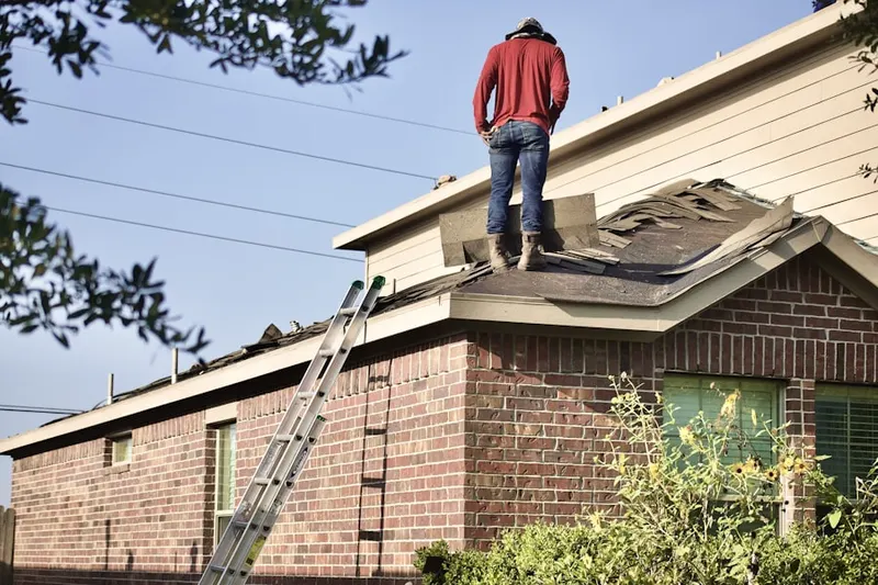 Professional roofer working on a residential roof in Shadow Ridge
